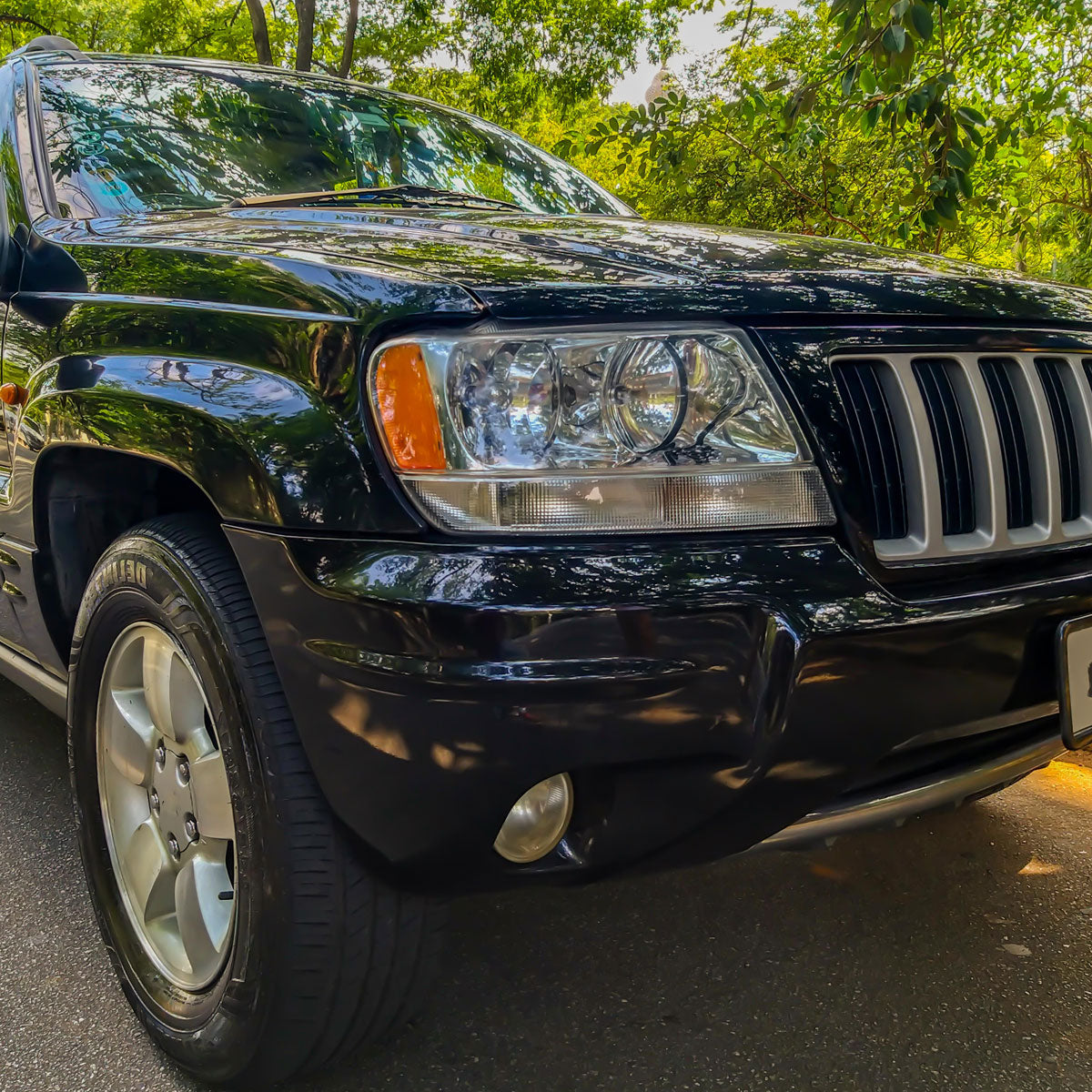 1999-2004 Jeep Grand Cherokee Factory Style Crystal Headlights w/ Amber Reflectors (Chrome Housing/Clear Lens)