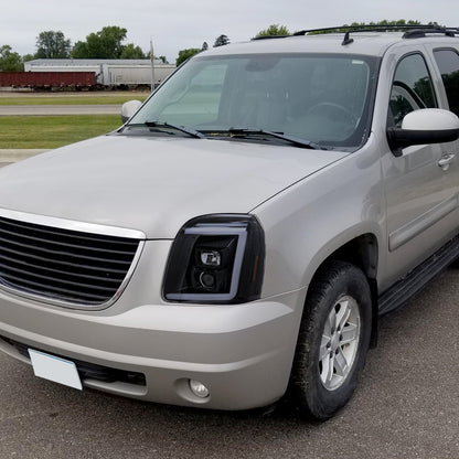 2007-2014 GMC Yukon/XL 1500/XL 2500 Switchback Sequential LED Turn Signal Projector Headlights (Glossy Black Housing/Smoked Lens)