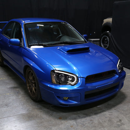 2004-2005 Subaru Impreza WRX/STI Outback Projector Headlights w/ LED Light Bar (Glossy Black Housing/Clear Lens)