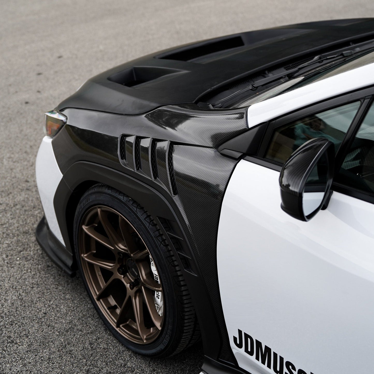 JDMuscle [22-25 WRX w/ FMIC] Carbon Fiber Scoopless Hood V1