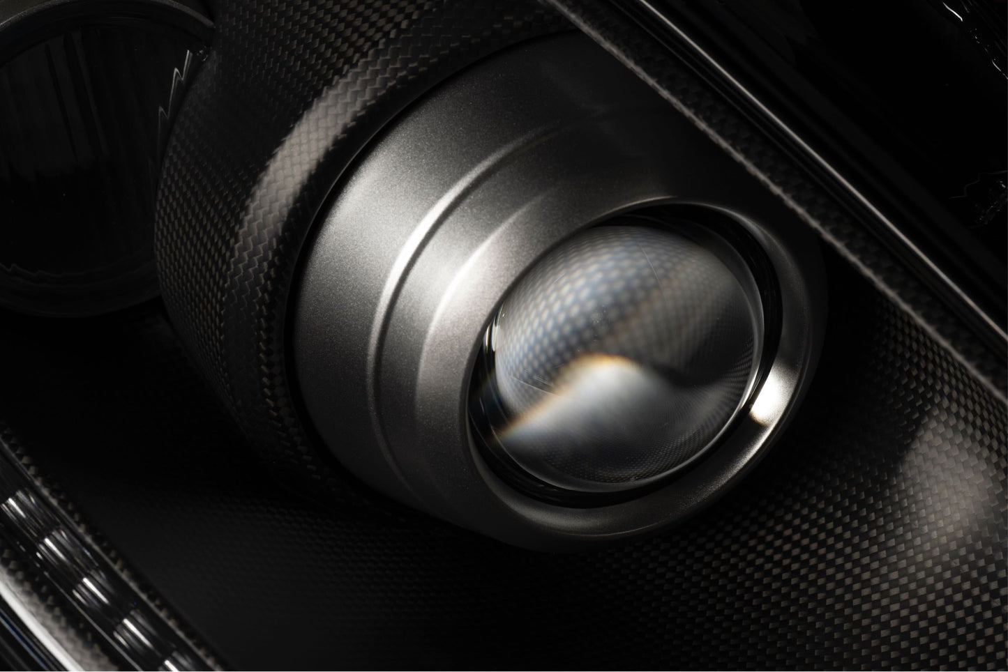Real matte carbon fiber bezel and satin titanium trim, Ferrari F430 headlight