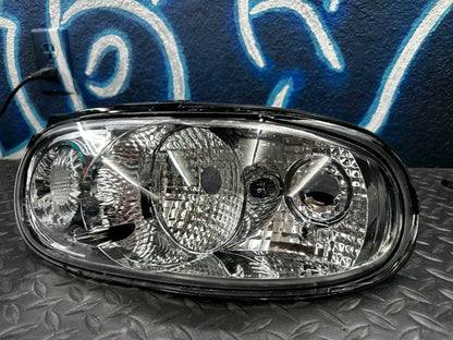 Front view of a single clear tail light for the 1990-1997 Mazda Miata NA chassis