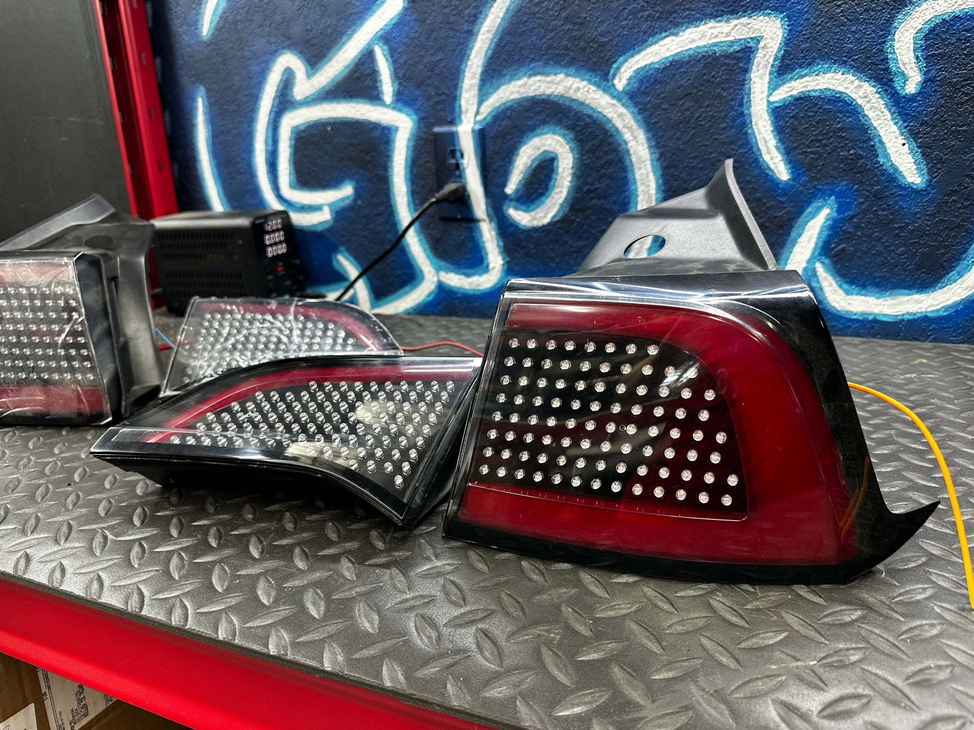 Tesla Model 3 RGB tail lights – outer and trunk lights, unlit side view